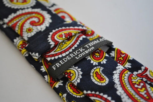 skinny cotton black tie with red and yellow paisley design